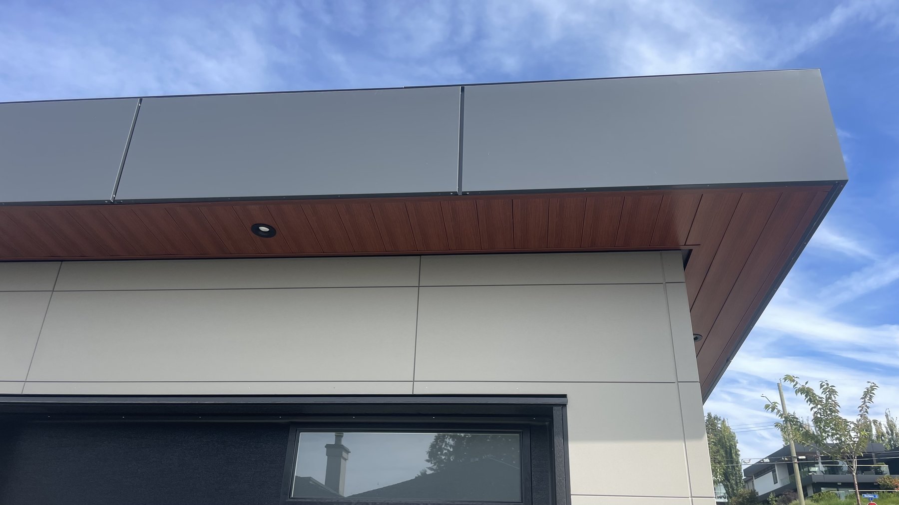 ACM panel installation on building facade at Atlant Industries project